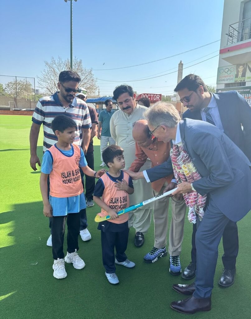 Neil Hawkins Hands Over Hockey Sticks to Young Players in Karachi