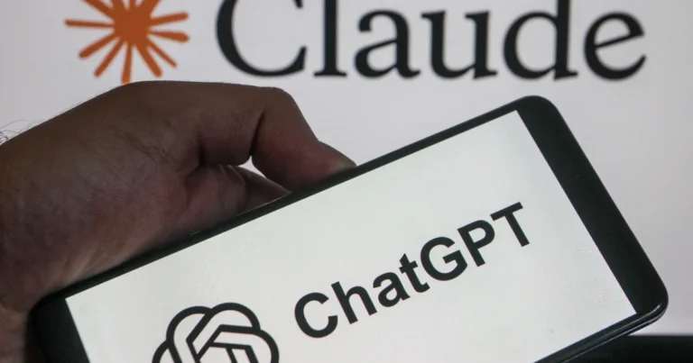 A hand holding a smartphone displaying the ChatGPT logo in front of a screen showing the Claude logo