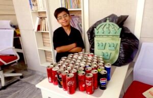 Young Pakistani Boy Creates Swedish Emblem from Recycled Cans