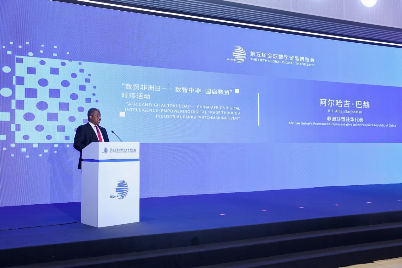 H.E. Alhaji Sarjoh Bah speaks at a podium during the African Digital Trade Day at the Fifth Global Digital Trade Expo