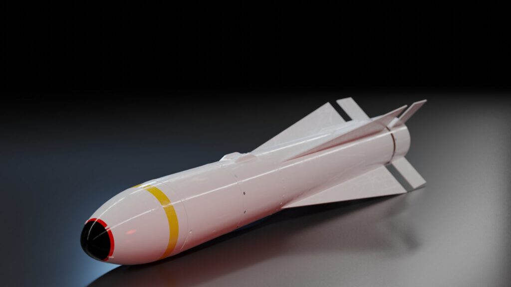 White guided missile with tail fins, a yellow stripe, and a black optical dome tip