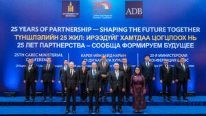 Group photo of officials on stage at the 25th CAREC Ministerial Conference in Mongolia