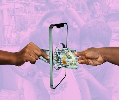 Hands passing US dollar bills through a smartphone frame against a background of children