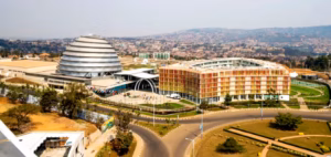 Aerial view of the Kigali Convention Centre featuring its iconic dome-shaped building and colorful adjacent hotel complex