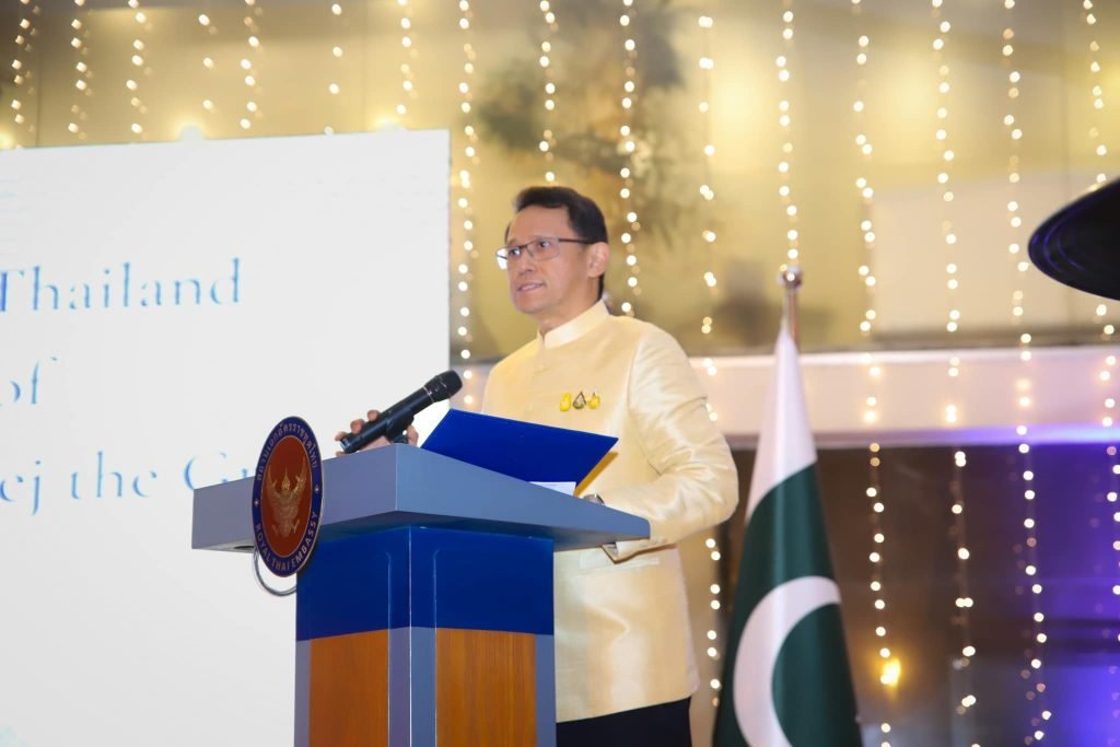 The Thai ambassador speaking at the 95th National Day of the Kingdom of Thailand celebration.