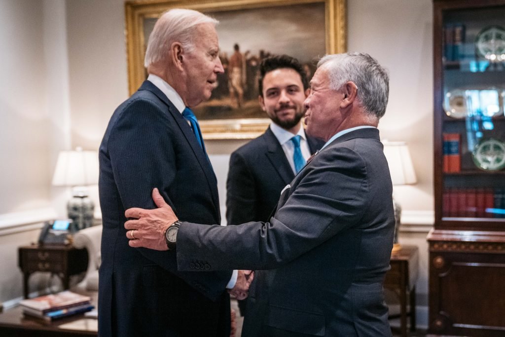 United States President Joe Biden shakes hands with Jordan's King Abdullah at the White House in Washington