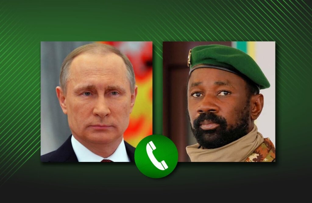 President Putin (R) engages with Interim President of Mali (L)
